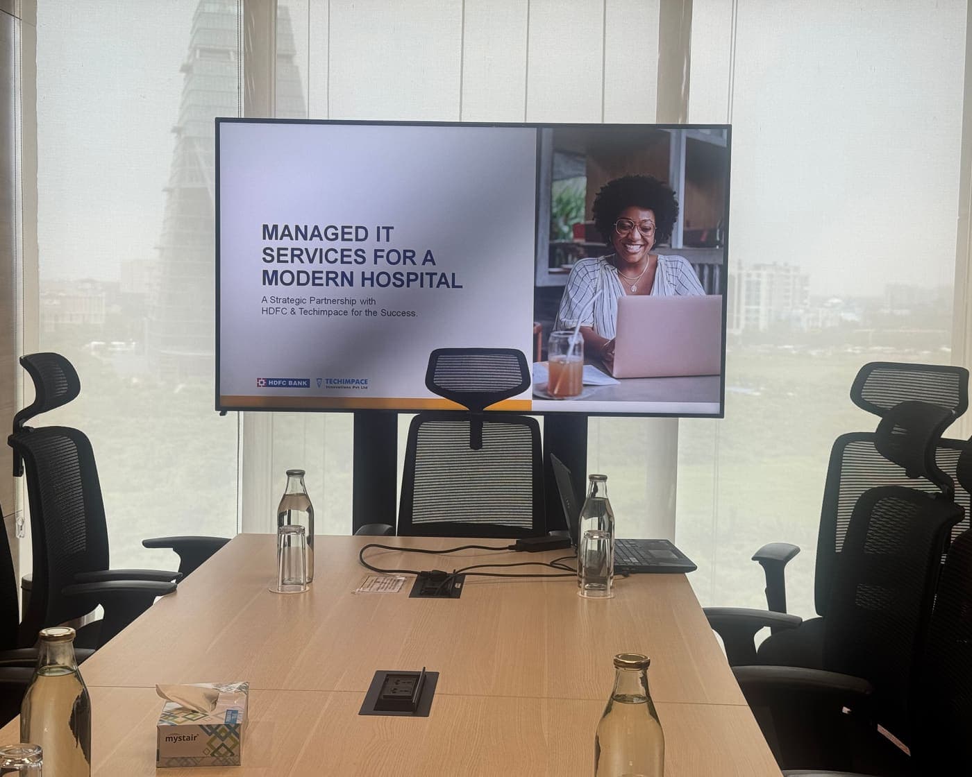 Corporate boardroom during a Techimpace and HDFC Bank managed IT services presentation